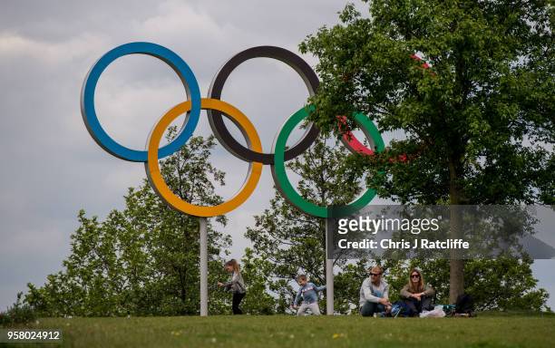 Family relaxes in front of the Olympic rings at Olympic Park as it is announced that Dame Tessa Jowell has died on May 13, 2018 in London, England....