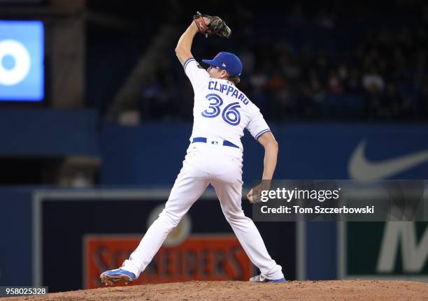 Tyler Clippard of the Toronto Blue Jays delivers a pitch in the ninth inning during MLB game action against the Boston Red Sox at Rogers Centre on...