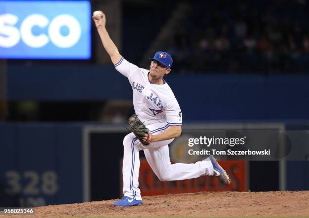 Tyler Clippard of the Toronto Blue Jays delivers a pitch in the ninth inning during MLB game action against the Boston Red Sox at Rogers Centre on...