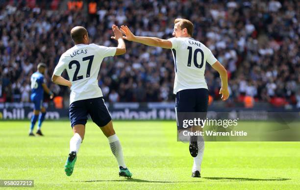 Harry Kane of Tottenham Hotspur celebrates with Lucas Moura of Tottenham Hotspur after scoring his sides first goal during the Premier League match...