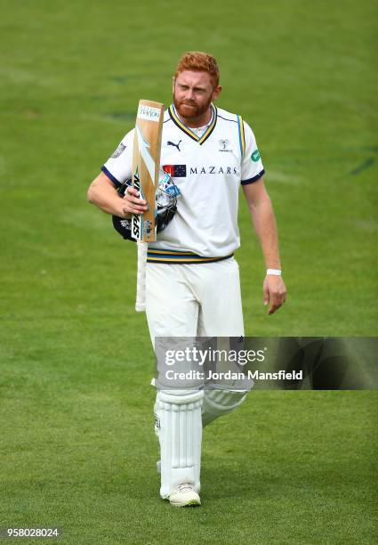 Jonny Bairstow of Yorkshire makes his way off the field after being dismissed by Jade Dernbach of Surrey during day three of the Specsavers County...