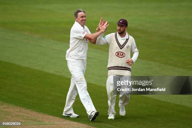 Rikki Clarke of Surrey celebrates dismissing Steve Patterson of Yorkshire during day three of the Specsavers County Championship Division One match...