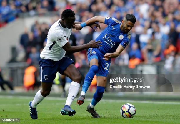 Victor Wanyama of Tottenham Hotspur battles for possession with Riyad Mahrez of Leicester City during the Premier League match between Tottenham...