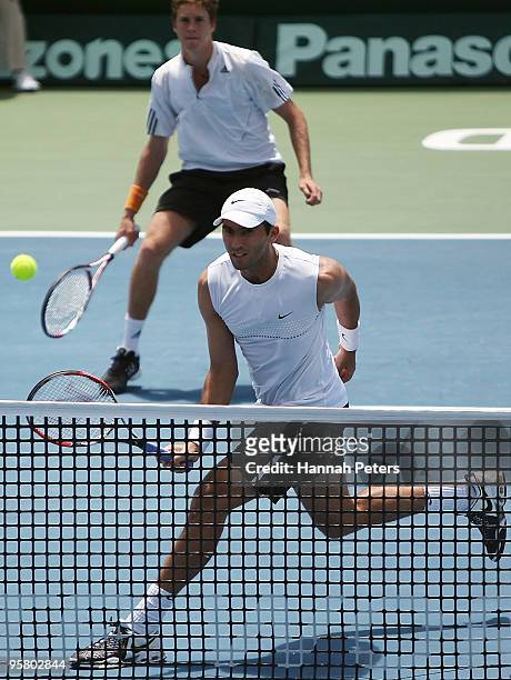 Horia Tecau of Romania volleys the ball ahead of Marcus Daniell of New Zealand during their doubles final match against Marcelo Melo and Bruno Soares...