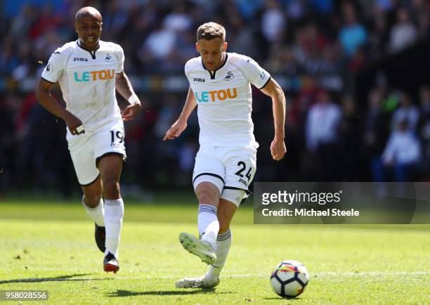 Andy King of Swansea City scores his sides first goal during the Premier League match between Swansea City and Stoke City at Liberty Stadium on May...