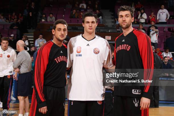 Danilo Gallinari of the New York Knicks poses with Marco Belinelli and Andrea Bargnani of the Toronto Raptors before the game on Italian Heritage...