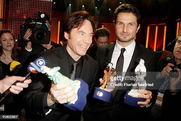 Actor, director Michael 'Bully' Herbig and director Simon Verhoeven poses with Award at the afterparty of the Bavarian Movie Award 2010 at the...