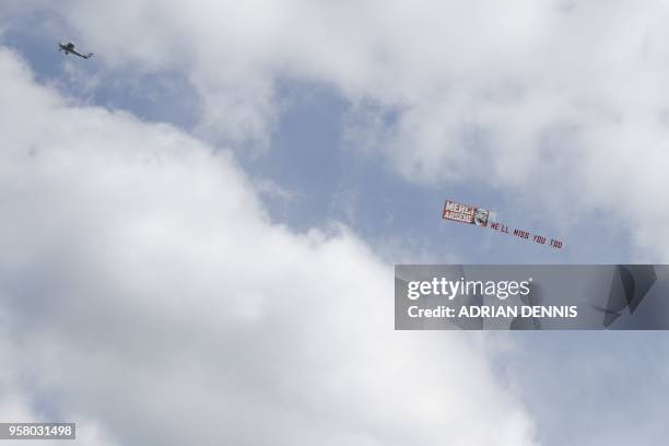 Plane carries a banner bidding farwell to Arsenal's French manager Arsene Wenger before the English Premier League football match between...