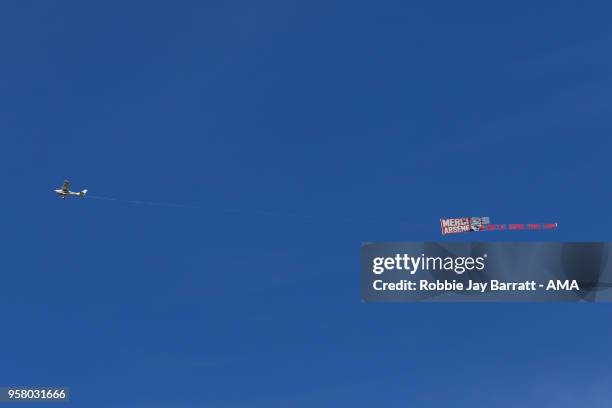 Plane flies over The John Smiths Stadium, home stadium of Huddersfield Town with a message for Arsene Wenger head coach / manager of Arsenal during...