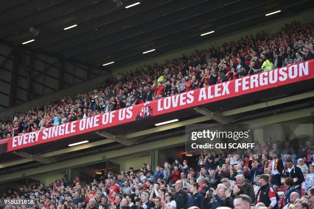 Banner wishing former manager Alex Ferguson, who is convalescing after having emergency surgery on a brain haemorrhage, is seen during the English...