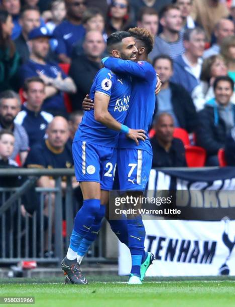 Riyad Mahrez of Leicester City celebrates scoring his sides second goal with team mate Demarai Gray of Leicester City during the Premier League match...