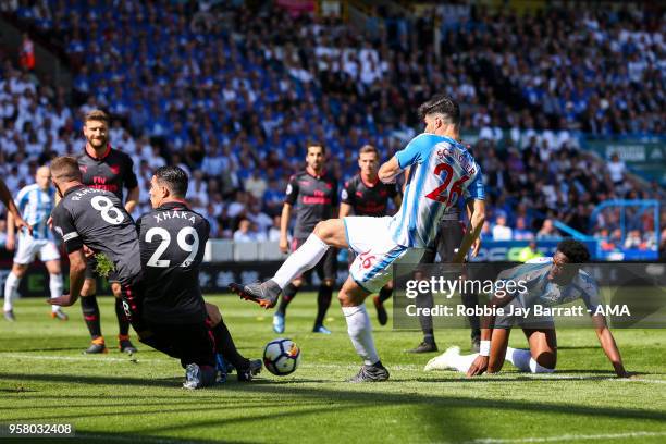 Granit Xhaka of Arsenal and Christopher Schindler of Huddersfield Town during the Premier League match between Huddersfield Town and Arsenal at John...