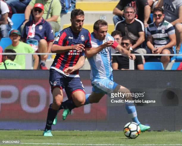 Mario Sampirisi of Crotone competes for the ball with Senad Lulic of Lazio during the serie A match between FC Crotone and SS Lazio at Stadio...