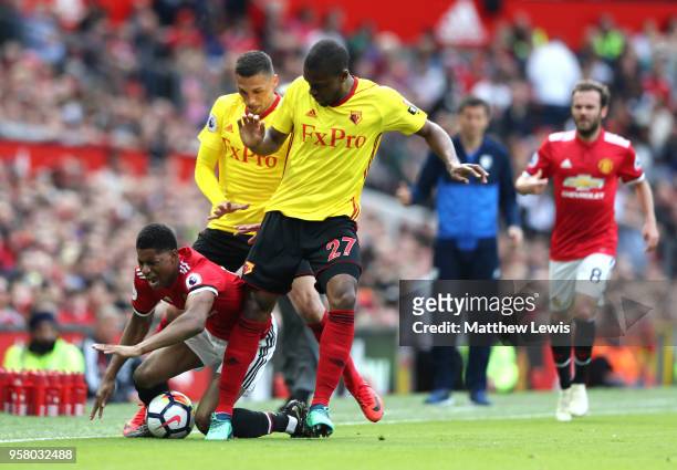 Marcus Rashford of Manchester United is tackled by Christian Kabasele of Watford during the Premier League match between Manchester United and...