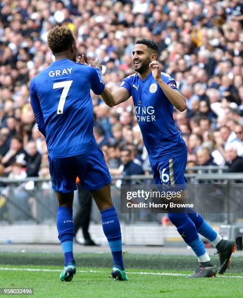 Riyad Mahrez of Leicester City celebrates scoring his sides second goal with team mate Demarai Gray of Leicester City during the Premier League match...