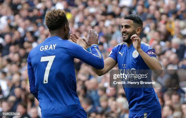 Riyad Mahrez of Leicester City celebrates scoring his sides second goal with team mate Demarai Gray of Leicester City during the Premier League match...