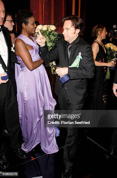 Author Waris Dirie and actor, director Michael 'Bully' Herbig attend the afterparty of the Bavarian Movie Award 2010 at the Prinzregententheater on...