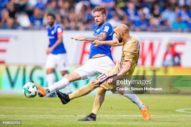 Felix Platte of Darmstadt is challenged by Philipp Riese of Aue during the Second Bundesliga match between SV Darmstadt 98 and FC Erzgebirge Aue at...