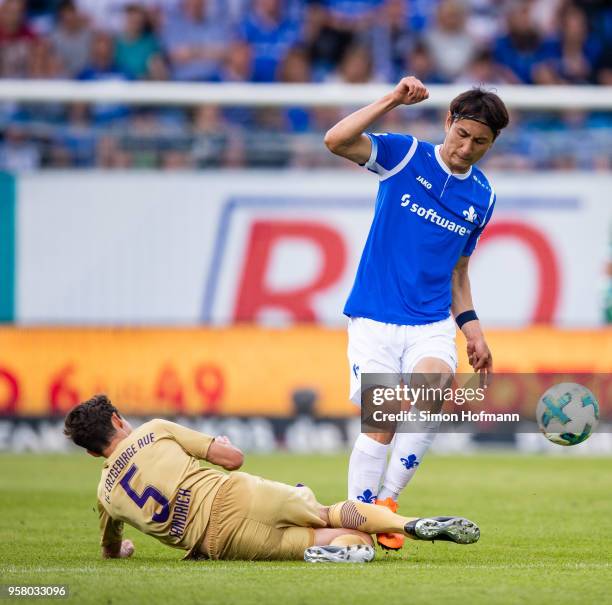 Dong-Won Ji of Darmstadt is challenged by Clemens Fandrich of Aue during the Second Bundesliga match between SV Darmstadt 98 and FC Erzgebirge Aue at...