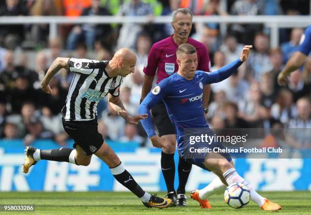 Jonjo Shelvey of Newcastle United and Ross Barkley of Chelsea battle for possession during the Premier League match between Newcastle United and...