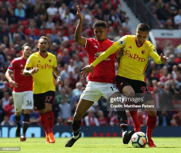 Marcus Rashford of Manchester United in action with Jose Holebas of Watford during the Premier League match between Manchester United and Watford at...