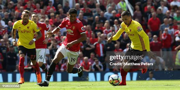 Marcus Rashford of Manchester United in action with Jose Holebas of Watford during the Premier League match between Manchester United and Watford at...