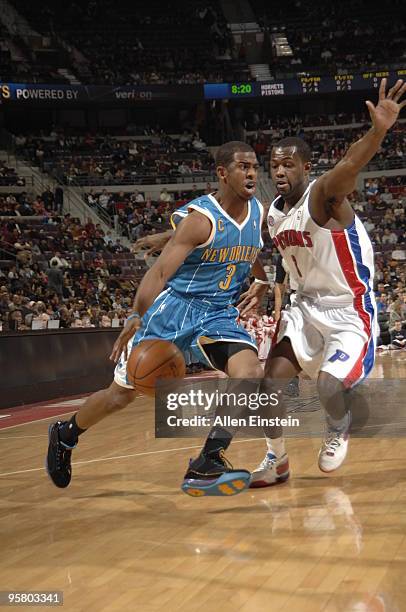 Chris Paul of the New Orleans Hornets drives against Rodney Stuckey of the Detroit Pistons in a game at the Palace of Auburn Hills on January 15,...