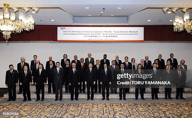 Japanese Prime Minister Yukio Hatoyama poses with foreign ministers from East Asia and Latin America at a photo session at the opening session of the...