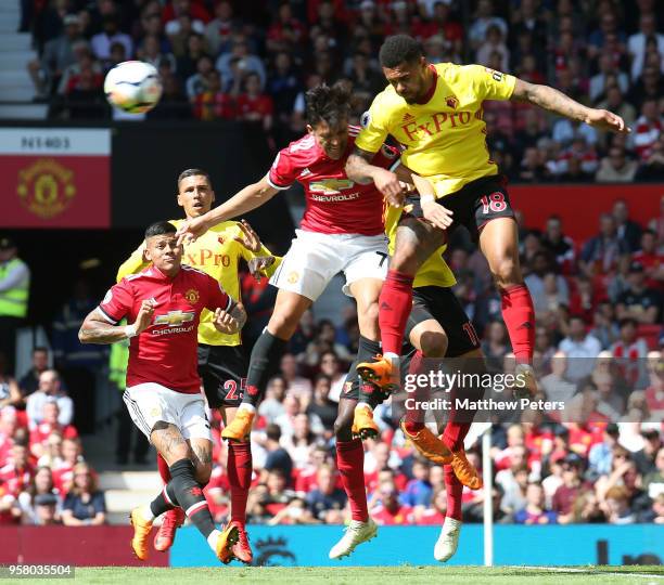 Alexis Sanchez of Manchester United in action with Andre Gray of Watford during the Premier League match between Manchester United and Watford at Old...