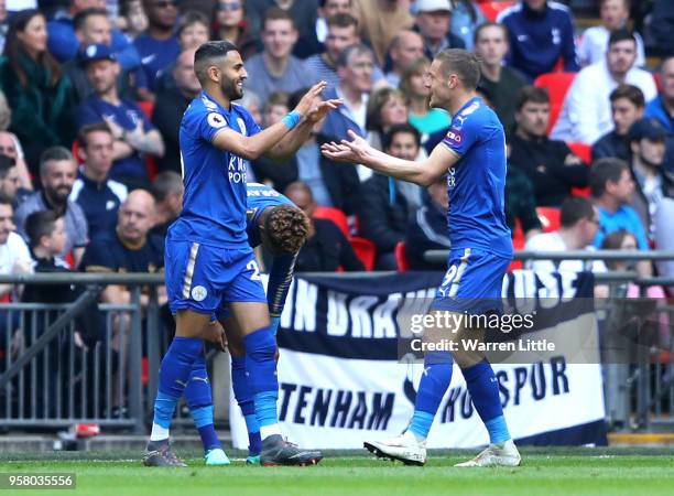 Riyad Mahrez of Leicester City celebrates scoring his sides second goal with team mate Jamie Vardy during the Premier League match between Tottenham...