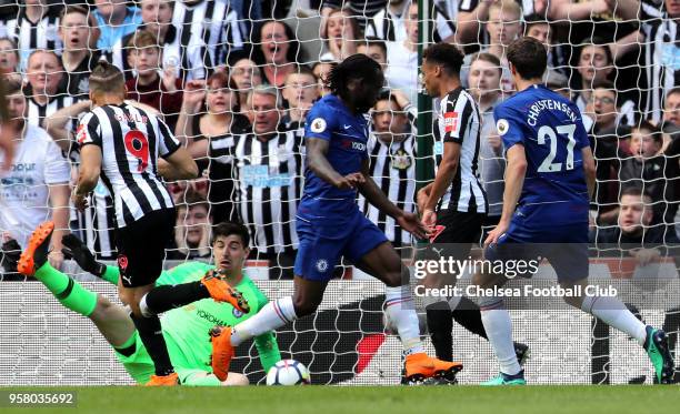 Dwight Gayle of Newcastle United scores his sides first goal during the Premier League match between Newcastle United and Chelsea at St. James Park...