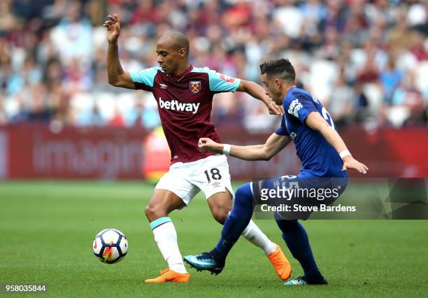 Joao Mario of West Ham United battles for possession with Ramiro Funes Mori of Everton during the Premier League match between West Ham United and...
