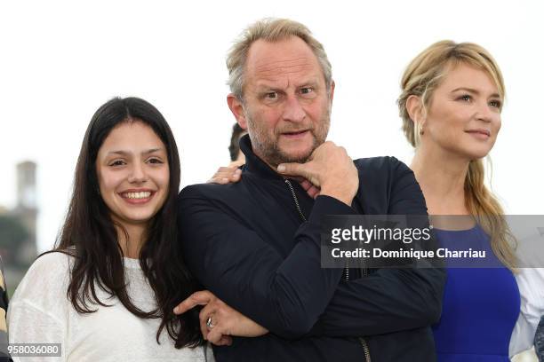 Noee Abita,Benoit Poelvoorde and Virginie Efira attend the photocall for the "Sink Or Swim " during the 71st annual Cannes Film Festival at Palais...