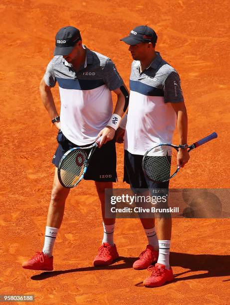 Bob Bryan of the United States is helped off court by Mike Bryan of the United States after receiving an injury playing against Nikola Mektic of...