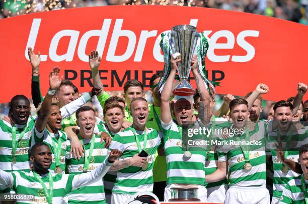 Scott Brown of Celtic lifts the Ladbrokes Scottish Premier League trophy as Celtic take the title during the Scottish Premier League match between...