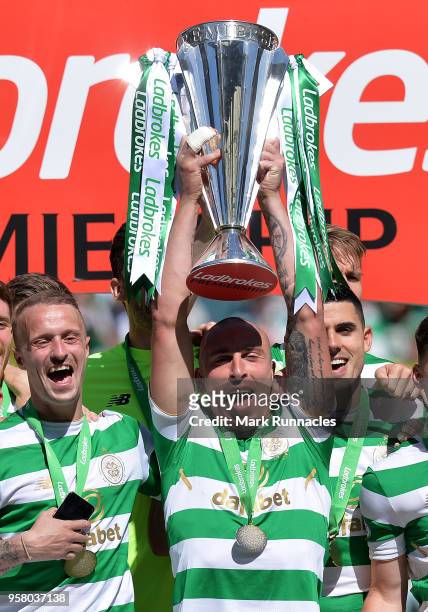 Scott Brown of Celtic lifts the Ladbrokes Scottish Premier League trophy as Celtic take the title during the Scottish Premier League match between...
