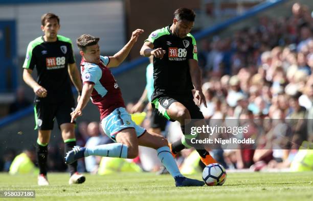 Matthew Lowton of Burnley and Lys Mousset of AFC Bournemouth in action during the Premier League match between Burnley and AFC Bournemouth at Turf...
