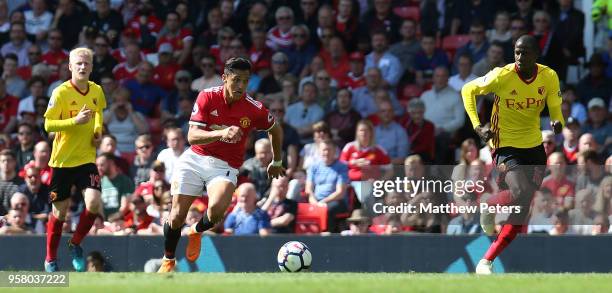 Alexis Sanchez of Manchester United in action with Abdoulaye Doucoure of Watford during the Premier League match between Manchester United and...