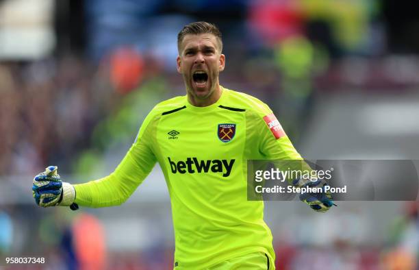 Adrian of West Ham United celebrates after Manuel Lanzini pictured) of West Ham United scores his sides first goal during the Premier League match...