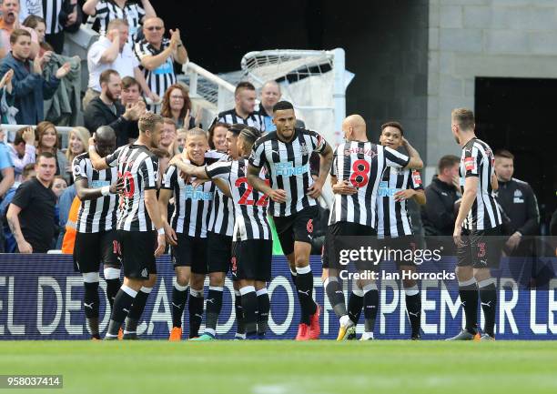 Dwight Gayle of Newcastle celebrates scoring the opening goal during the Premier League match between Newcastle United and Chelsea at St. James Park...