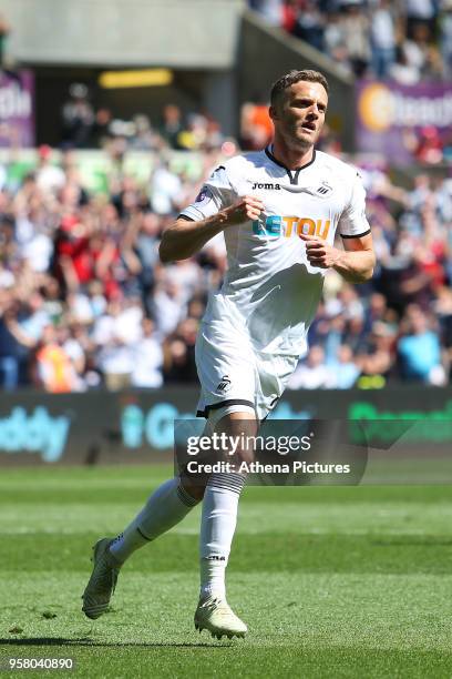 Andy King of Swansea City celebrates scoring his sides first goal of the game during the Premier League match between Swansea City and Stoke City at...