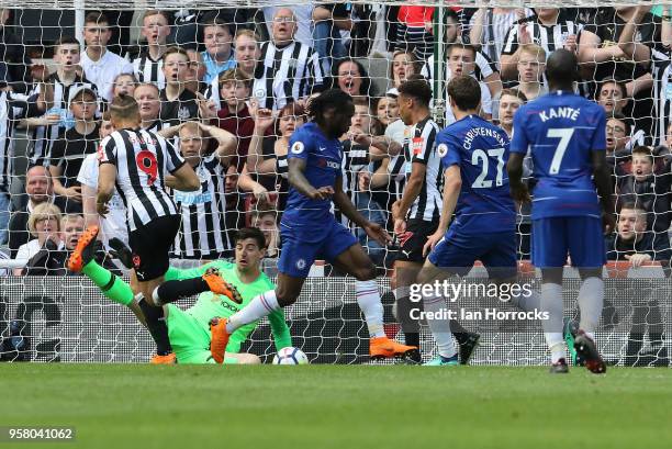 Dwight Gayle of Newcastle scores the opening goal during the Premier League match between Newcastle United and Chelsea at St. James Park on May 13,...