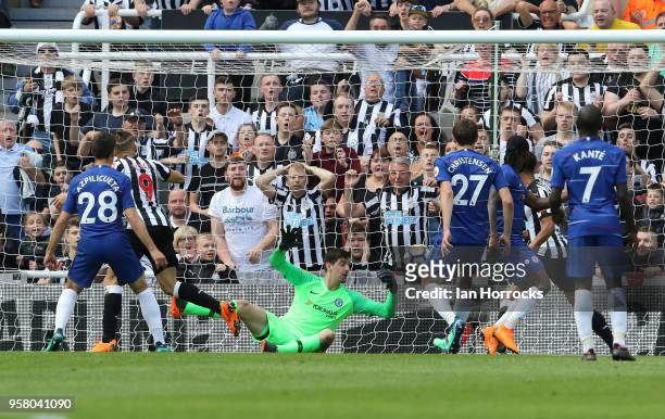 Dwight Gayle of Newcastle scores the opening goal during the Premier League match between Newcastle United and Chelsea at St. James Park on May 13,...