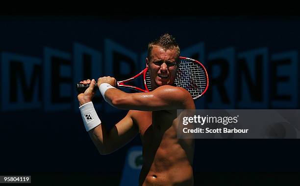 Lleyton Hewitt of Australia hits a shot during a practice session ahead of the 2010 Australian Open at Melbourne Park on January 16, 2010 in...