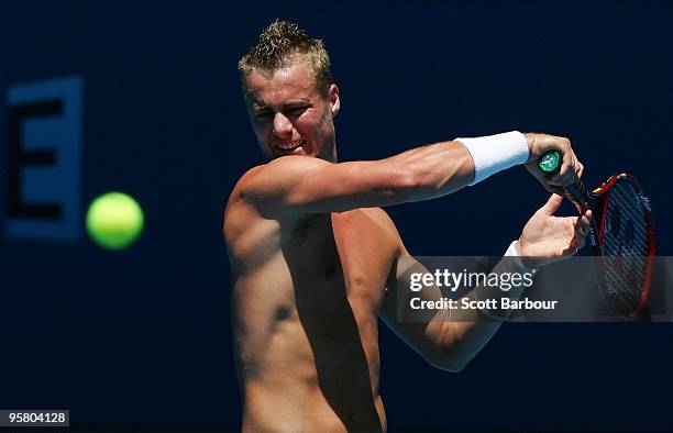 Lleyton Hewitt of Australia hits a shot during a practice session ahead of the 2010 Australian Open at Melbourne Park on January 16, 2010 in...