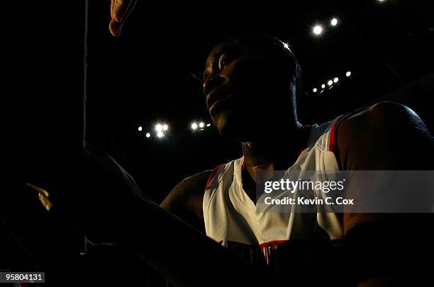 Jamal Crawford of the Atlanta Hawks signs an autograph after hitting a game-winning three-point basket against the Phoenix Suns at Philips Arena on...