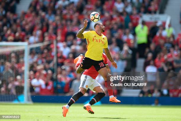 Watford's English striker Andre Gray and Manchester United's Argentinian defender Marcos Rojo go for the ball during the English Premier League...