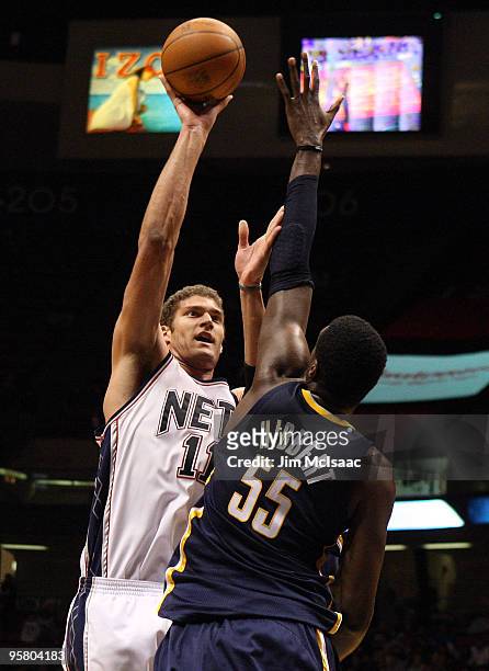 Brook Lopez of the New Jersey Nets shoots against Roy Hibbert of the Indiana Pacers at the Izod Center on January 15, 2010 in East Rutherford, New...