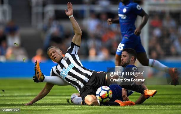 Chesea defender Gary Cahill fouls Dwight Gayle of Newcastle during the Premier League match between Newcastle United and Chelsea at St. James Park on...