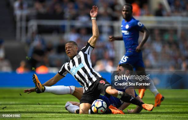 Chesea defender Gary Cahill fouls Dwight Gayle of Newcastle during the Premier League match between Newcastle United and Chelsea at St. James Park on...